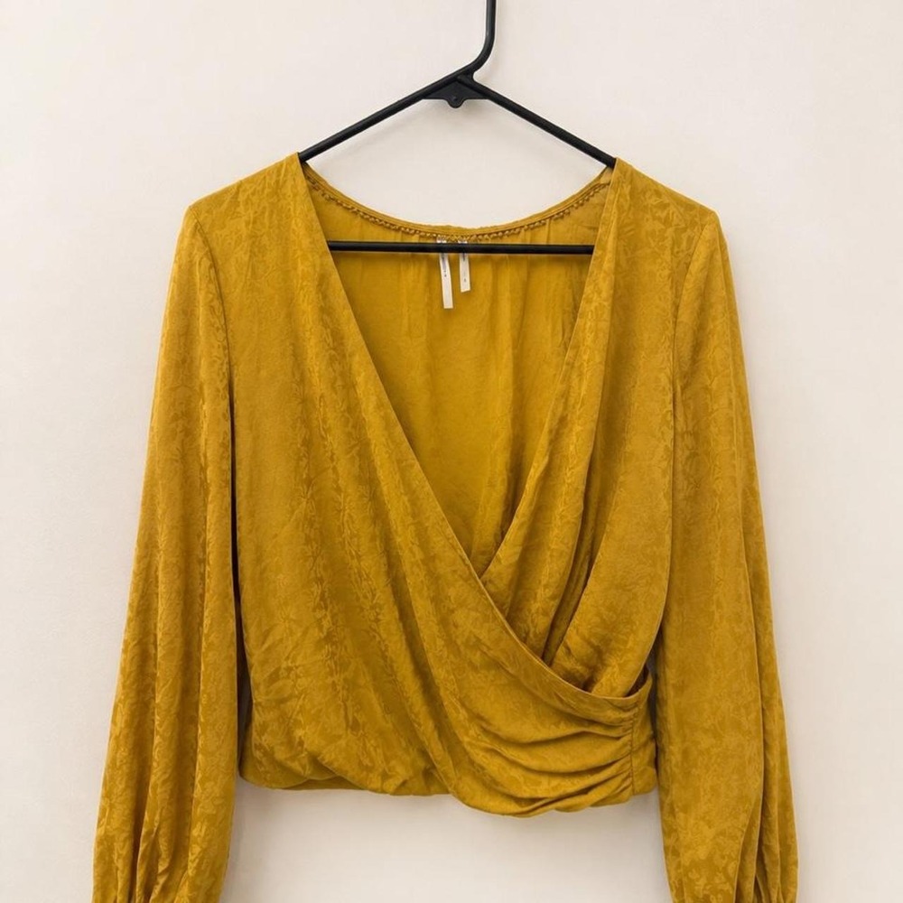 Anthropologie mustard yellow wrap shirt with subtle pattern